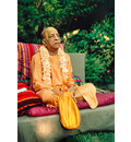 Prabhupada Outside on Vyasasana on Grass with Big Beadbag