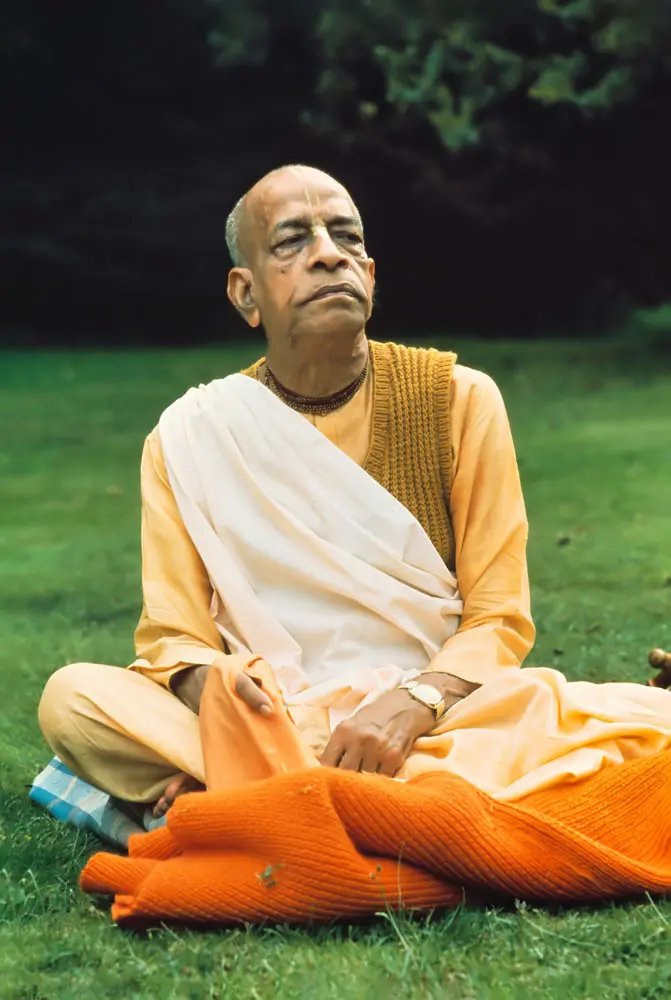 Prabhupada Sitting on Blanket on Grass Chanting Japa
