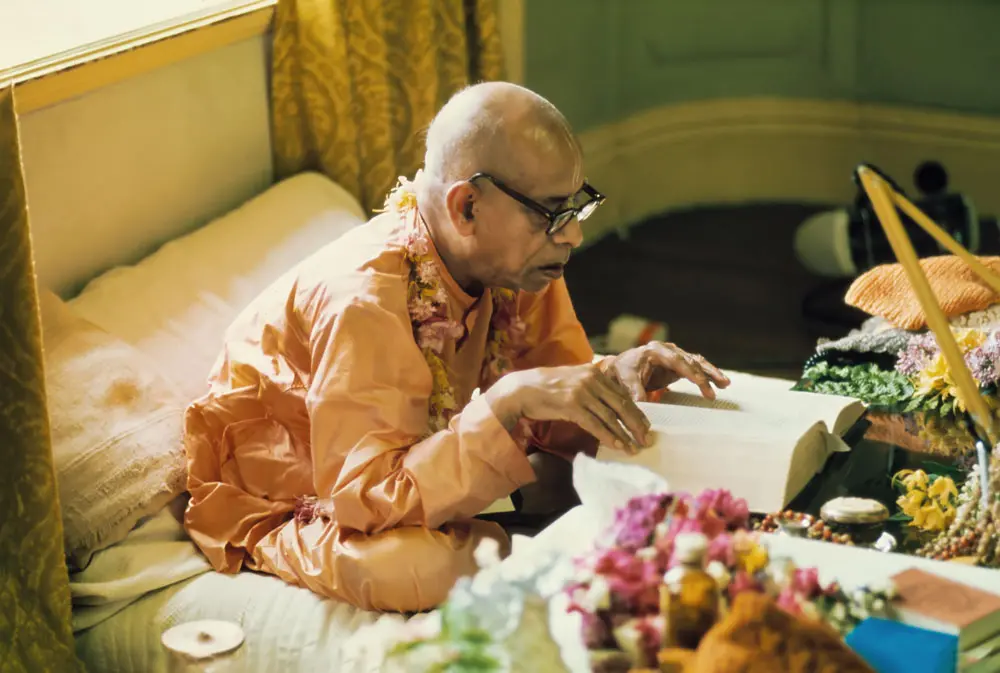 Prabhupada Reading Book at his Desk