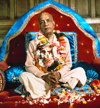 Srila Prabhupada in London on Red and Blue Vyasasana with Folded Hands